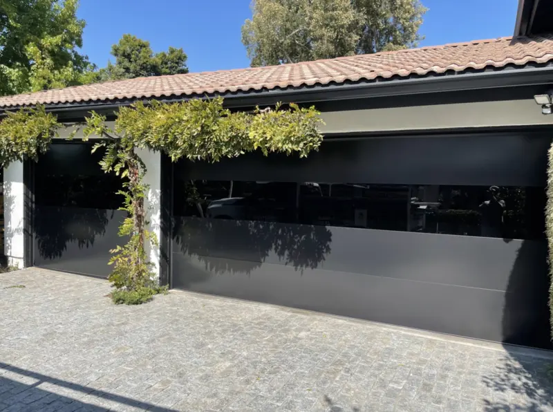 #2 C.H.I. 2717 Sterling Deep Black W_ 3rd Panel Infinity Glass garage featuring two large doors